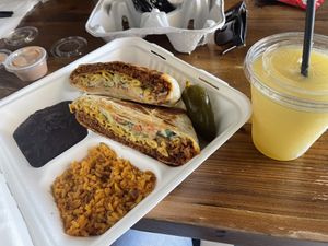 Nuno’s Crunchwrap w/ side of black beans and rice.   at Nuno's Tacos & Vegmex Grill in Dallas