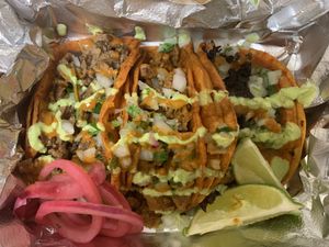 Street tacos on corn at Nuno's Tacos & Vegmex Grill in Dallas