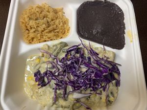 Chipotle shredded “chicken” enchiladas in the roasted poblano pepper sauce with rice and beans  at Nuno's Tacos & Vegmex Grill in Dallas