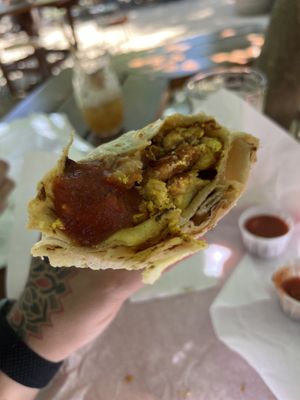 Bakon breakfast burrito with their red salsa  at Amo Nakatl Asada in Temecula