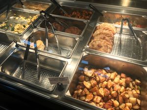 Hot food side. Tofu Egg scramble, mushroom gravy, sweet potato hash, seitan patties, biscuits, mixed veggies, taco hand pies and breakfast potatoes.  at The Park Side Cafe in Olympia
