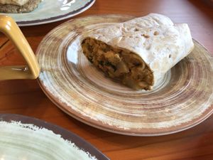 Delicious breakfast burrito...they are huge. at The Park Side Cafe in Olympia