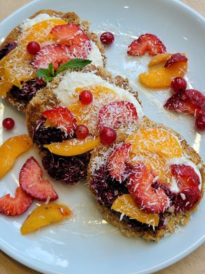 Millet buckwheat pancakes, cashew yogurt, jam and fruit at Namu ნამუ - Maybe closed in Tbilisi