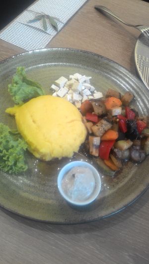 MAMALIGA with tofu, vegetable saute and sauce. at Go Fresh in Chisinau