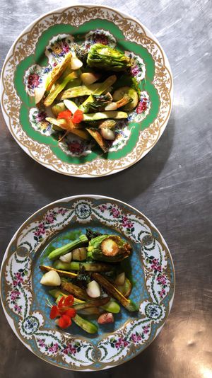 Stuffed squash blossoms baby squash herb pesto and nasturtium flowers  at Local Vegan in Seattle