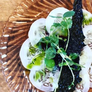 Cucumber carpaccio huckleberry compote and kale chip  at Local Vegan in Seattle