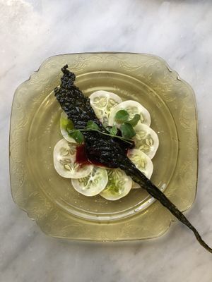 Cucumber carpaccio huckleberry compote and kale chip  at Local Vegan in Seattle