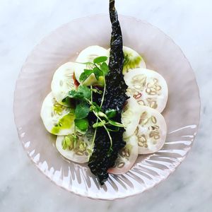 Cucumber carpaccio huckleberry compote and kale chip  at Local Vegan in Seattle