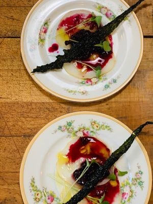 Cucumber Carpaccio, huckleberries, micro greens, kale chip   at Local Vegan in Seattle
