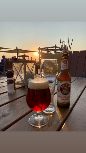 Beer and sunrise  at Beachclub Copacabana in The Hague