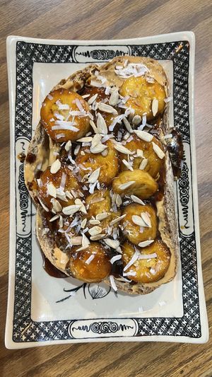 Caramalized bread with banana and peanut butter   at Ngon Vegan Restaurant in Tam Coc