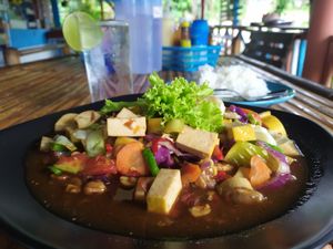 Fried vegatables with rice and free water  at Happy Cup Restaurant in Pai