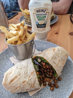 Spanish harissa chickpea wrap and skin on fries at Farmhouse Kitchen in Kendal