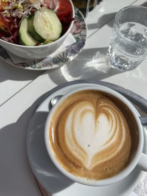Side salad and oat milk cappuccino   at The Heart of Joy in Salzburg