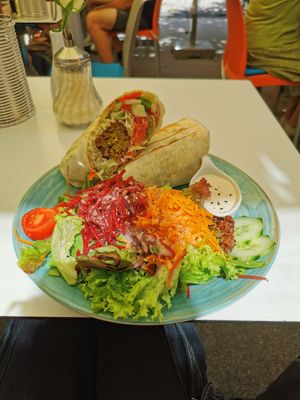 Falafel Wrap with Tahini Sauce and a side salad at The Heart of Joy in Salzburg