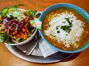 Curry with rice and salad at The Heart of Joy in Salzburg