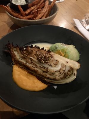 Roasted Cabbage with avocado, vegan carrot creme and vegan hollandaise, sweet potato fries with vegan truffel-mayo  at Lab071 in Leiden