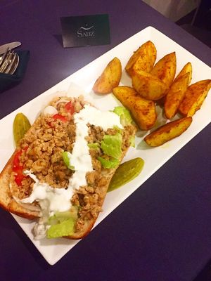 Vegan beef crumble with side of potato wedges  at Sabz in Northampton