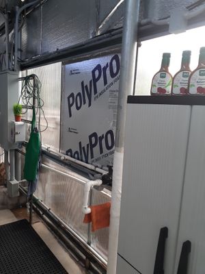 Taken inside the Greenhouse at Universal Living Sprouts on 9.26.2024 - improper building materials used - Insulation  Boards treated with termite insecticide and wrapped in an aluminum foil tape, etc... at Universal Living Sprouts in West Palm Beach