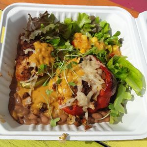 Pimiento Relleno: bell pepper stuffed w/ calabaza, brown rice, cauliflower "chorizo carnitas" tofu & seitan, ranchero sauce, & vegan Pepper Jack, w/ charro beans & fresh greens at Pepe's Bistro in Lincoln