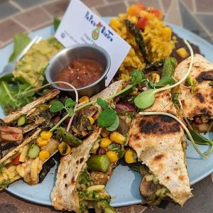 Pepita Mint Pesto Asparagus& Mushroom Quesadilla.
Ingredients:
Organic wheat tortilla with pepita mint pesto,vegan smoked gouda, herb roasted asparagus & crimini mushroom, sweet  at Pepe's Bistro in Lincoln