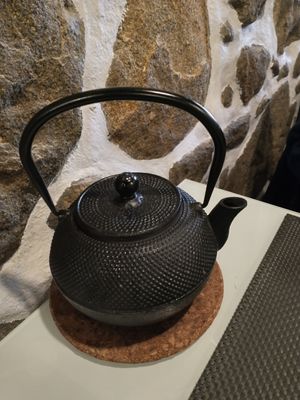 Complimentary pot of tea. And a lovely stone wall. at Gosto Superior in Braga