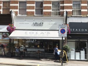 front of bakery  at Lola's Bakery in North West London