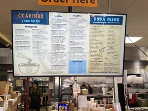 Menu above the cashier. Cannot read from afar.  at Cravings Deli in Portage