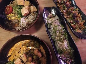 Two ramen bowl with gyoza (with BBQ sauce) and red beetroot with radish sauce at Kokomo Noodle Club in Hamburg