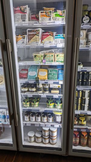 Veg*n fridge items - tofu, tempeh & plant cheese at Santos Organics and Natural Food in Mullumbimby