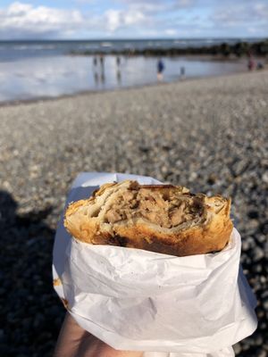 vegan sausage roll on the beach at Grey Seal Coffee in Sheringham