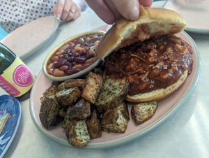 Jackfruit BBQ sandwich and cowboy beans and roast potatoes at Frannie's Vegan Cafe in Johnson City