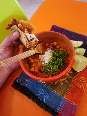Birria con tacos the birria is a tradicional Mexican dish. Its a soupy dish accompanied by 2 tacos at Veggicano Plant Based in Mexico City