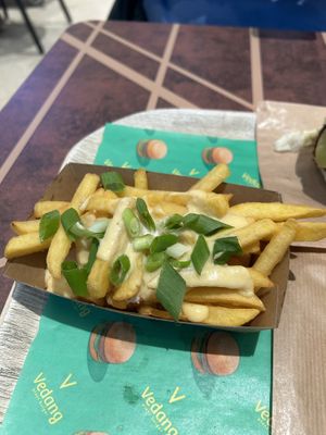 Loaded fries with “cheese"  at Vedang - green burger | Alexa in Berlin