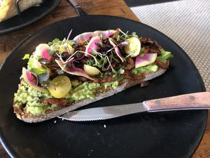 Avocado toast with mushroom bacon at Petisco Vegano in New York City