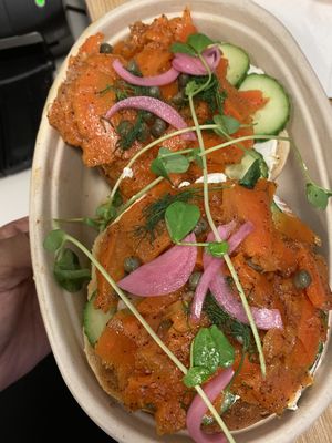 Carrot lox on bagel with capers and cucumbers. This was so delicious I definitely want it again soon   at Petisco Vegano in New York City