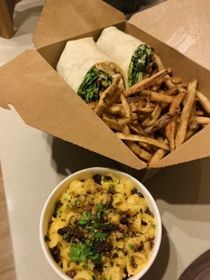 cup of Mac and cheese and Caesar wrap at Watercourse Foods in Denver