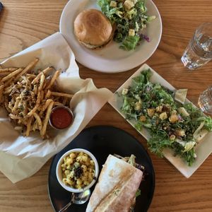 Our spread - chicken and Turkey sammies, Caesar salads, truffle fries (no hot sauce), and a side of mac at Watercourse Foods in Denver