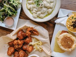 Benedict, cauliflower wings, gnocchi, side salad at Watercourse Foods in Denver