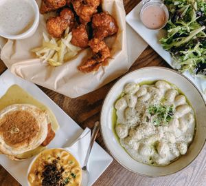 Benedict, cauliflower wings, gnocchi, side salad at Watercourse Foods in Denver