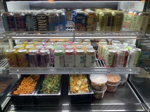 Cold case with drinks and salad. at Watercourse Foods in Denver