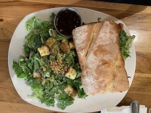 Turkey and brie sandwich with side Caesar salad…so good! at Watercourse Foods in Denver
