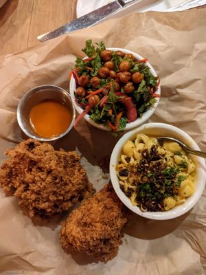 Fried cauliflower chicken with buffalo sauce, Kale salad, and Mac and cheese at Watercourse Foods in Denver