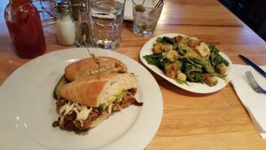 Cuban sandwich and caesar salad  at Watercourse Foods in Denver