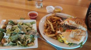 Sink your teeth into this luscious Classic Burger and Fries -- side Caesar salad, and lunch is complete! at Watercourse Foods in Denver