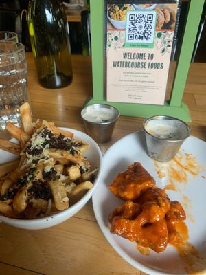 Cauliflower wings and loaded fries  at Watercourse Foods in Denver