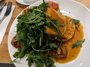 Roasted tomato Benedict at Watercourse Foods in Denver