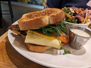 Breakfast sandwich with side salad at Watercourse Foods in Denver