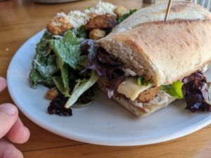 Turkey and Brie sandwich w/ Caesar salad at Watercourse Foods in Denver