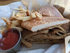 Cuban sandwich with fries at Watercourse Foods in Denver
